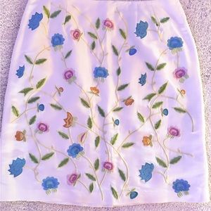 Patrick Christopher white silk skirt with floral embroidery.